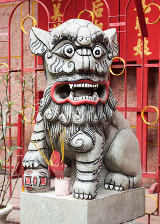 Chinese lion at the entrance of a templeの写真素材