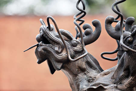 Dragon sculpture in a temple in Hanoi, Vietnam