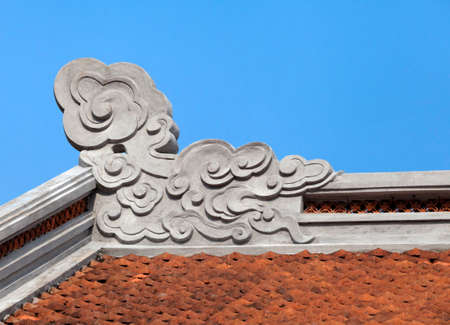 Decoration on a temple roof in Vietnamの写真素材