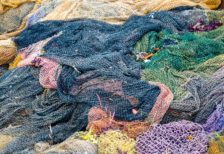 Colorful fishing nets abandoned on a ship cemetery