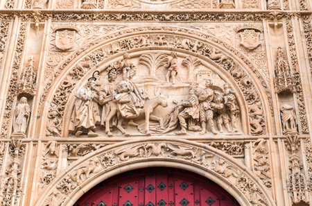Intricate sculptures adorn the entrance of Universidad de Salamanca, depicting historical events and figures in stunning detail.の写真素材