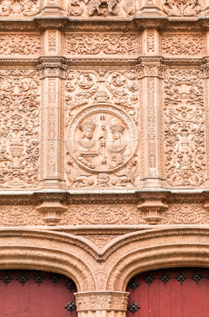 The elaborate facade features detailed stone carvings, showcasing the artistic heritage of Universidad de Salamanca.の写真素材