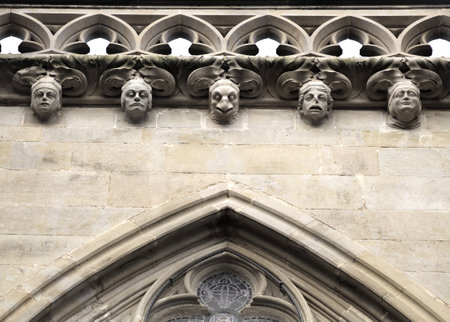 Intricate stonework adorns a historic facade in Carcassonne, France, showcasing artistry.の写真素材
