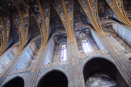 View of the stunning decorated ceiling in Sainte-Secile cathedral, capturing the vibrant colors and...