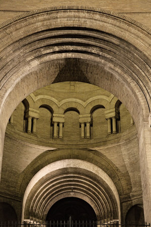 Historic Toulouse structure boasts intricate arches and columns, beautifully lit at night for a captivating view.の写真素材