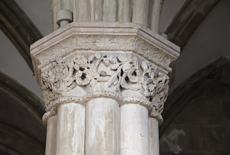 Ornate carvings adorn a stone column at Monastery Santa Maria, showing the artistry of Manueline architecture. The monastery, a UNESCO World Heritage site, reflects historical significance.の写真素材