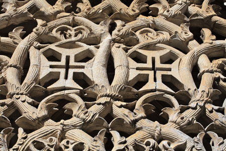 Detailed stonework showcases the remarkable craftsmanship of the Batalha Monastery. This historical site in Portugal reflects Gothic style and rich artistic heritage, attracting visitors worldwide.の写真素材