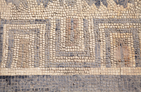 Detailed view of ancient Roman mosaics in Conimbriga, showcasing geometric patterns and historical craftsmanshipの写真素材