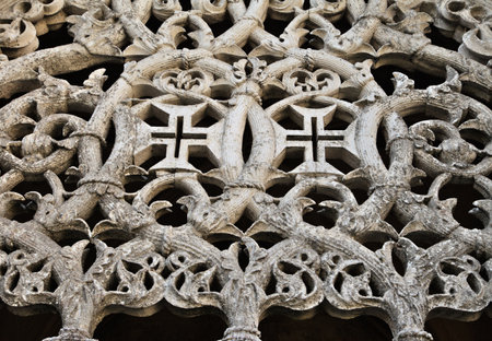Detailed stonework showcases the remarkable craftsmanship of the Batalha Monastery. This historical site in Portugal reflects Gothic style and rich artistic heritage, attracting visitors worldwide.の写真素材