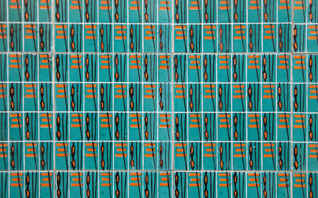 Bright azulejo tiles in Portugal showcase intricate geometric patterns, reflecting local...