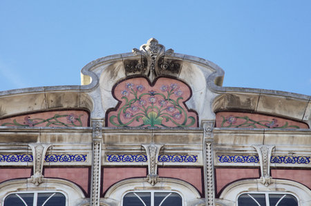 Colorful floral patterns and intricate designs adorn the facade of an historic building in Aveiro, Portugal on a sunny dayの写真素材