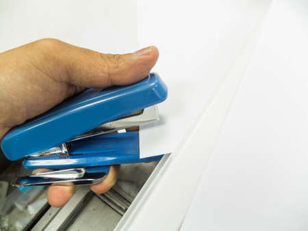 Stapling papers with staplerの写真素材