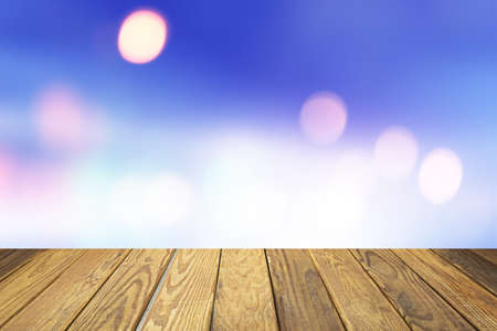 Empty wood table over blurred nature with bokeh background, product display templateの写真素材