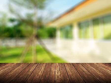 Wooden top board empty table in front of blurred home background. Perspective wood over nature view  for display or montage your products.の写真素材