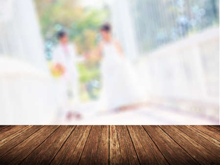Empty wood table over blurred wedding with bokeh background, product display template,deck,の写真素材