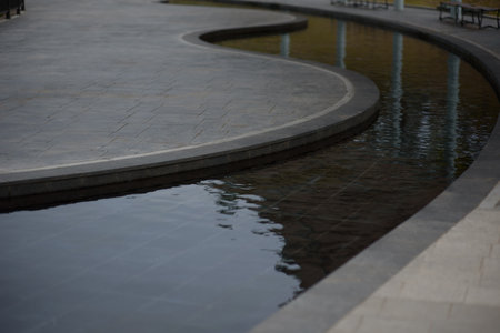 Wet stone walkway in the park, closeup of photoの写真素材