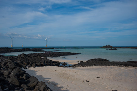 Wind Turbines on the Beach in Jeju, south koreaの写真素材