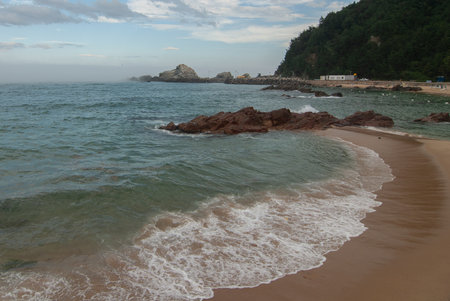 Walking on the East Coast of Korea at sunsetの写真素材