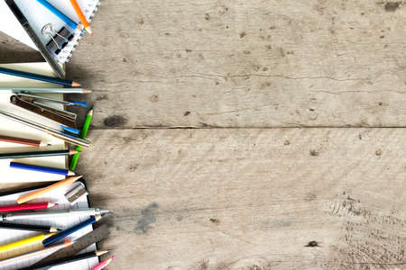 Notebook, Pen and Pencil on Wooden Deskの写真素材