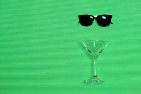 Summer Party Time To Relax with SunGlasses and Wine on Pastel Background. Vintage Design Style for Invitation Cardの写真素材