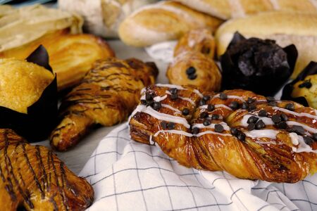 Bread, Croissant, Muffin Chocolate Bakery Party Breakfast at home. Cooking food with Rolling Pin on...
