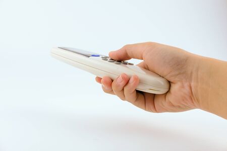 Close up hand women using remote controller open The air conditioner on White Background. Health,...