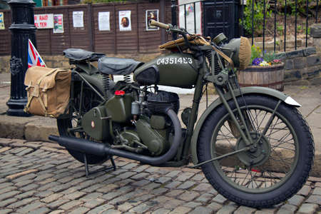 CRICH, ENGLAND - APRIL 17, 2017: A vintage military motorcycle at the World War II - Home Front 1940s event at the Crich Tramway Village in Derbyshire.のeditorial素材