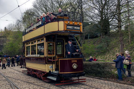 CRICH, ENGLAND - APRIL 17, 2017: Vintage Tram at the World War II - Home Front 1940s event at Crich Tramway Village in Derbyshire, UK, home of the National Tramway Museum.のeditorial素材