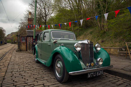 CRICH, ENGLAND - APRIL 17, 2017: Vintage MG car at the World War II - Home Front 1940s event at...