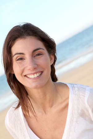 Portrait of beautiful smiling woman at the beach Portrait of beautiful smiling woman at the beach