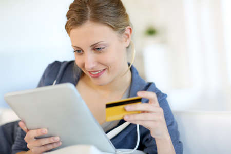 Closeup of beautiful blond girl doing online shopping Closeup of beautiful blond girl doing online shopping