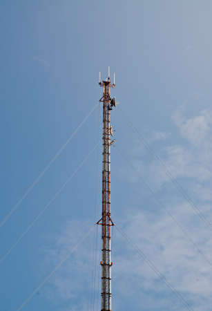 this is a Radio transmission towers on blue sky background
