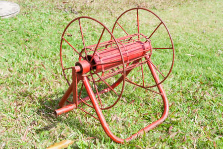 This is a Hose storage on grassの写真素材