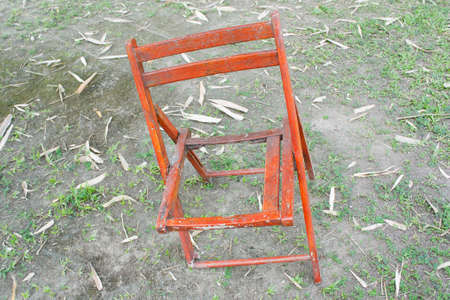 broken chair on ground and glassの写真素材