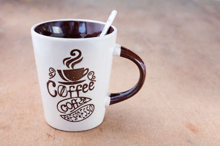 coffee Mug with a spoon, empty space to the right handside
