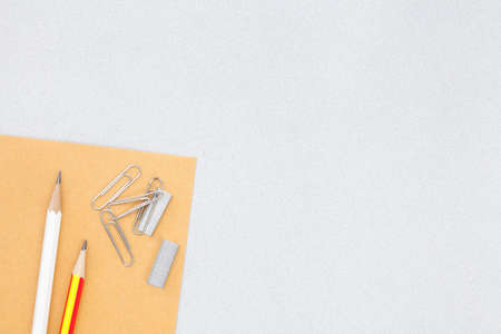pencil clip staples and scissors placed on gray background, leave space for copyの写真素材