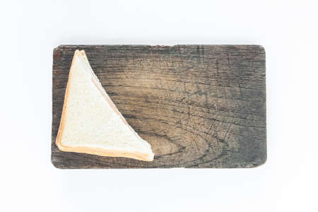 sandwich ham on wood plate top white background not isolated backgroundの写真素材