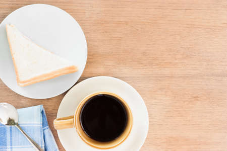 sandwich coffee and tea spool on wood texture, with copy spaceの写真素材