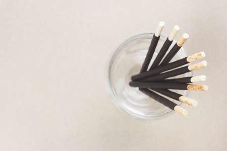 Chocolate biscuits sticks in glass, it's a sweet snack  in top view and copy spaceの写真素材