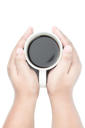 two yellow brown skin tone hands holding white coffee cup on isolated background , from top viewの写真素材