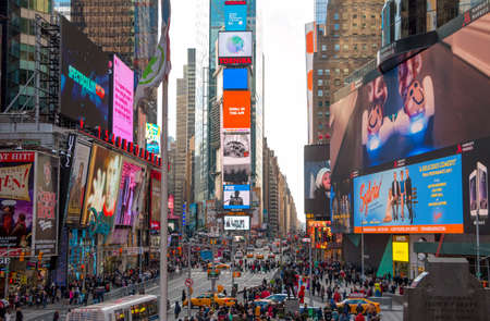 USA, New York City. Daytime. A lot of people, cars and advertisements in Times Square. Editorial Use Onlyのeditorial素材
