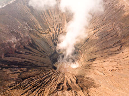 Indonesia. Java island. The active volcano Bromo. Aerial view of the slopes of the crater and smokeの写真素材
