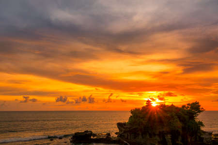 Indonesia. Bali island. Sunset over the ocean and the Tanah Lot Templeの写真素材