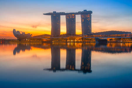 Singapore. Marina Bay Sands Hotel. Colorful sunrise and calm water of the bayのeditorial素材
