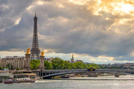 France. Paris. Heavy clouds and the rays of the sun. Traffic on the Seineの写真素材