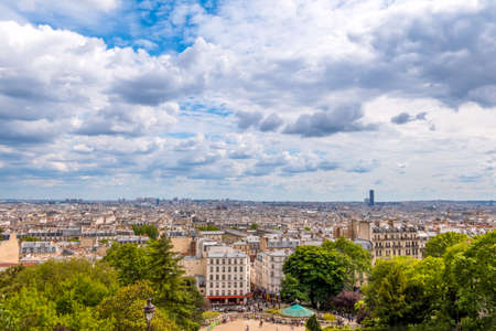 France. Paris. Summer day. Panoramic view of the roofs. The clouds are running fast. The Eiffel Tower is not visibleの写真素材