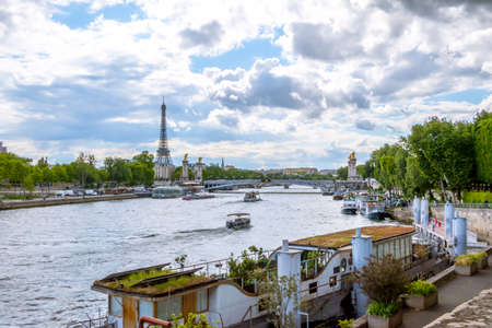 France. Paris. Sunny summer day. Water traffic on the River Seine with a view of the Eiffel Towerの写真素材