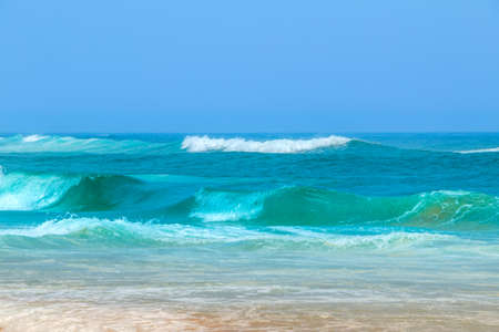 Shore of the Atlantic Ocean and blue sky. Surf