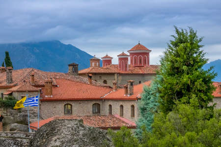 Greece. Summer cloudy day in Meteora. Red roofs and crosses on a greek monasteryのeditorial素材