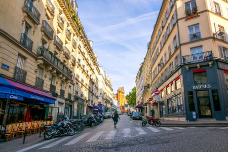 France, Paris. Sunny summer morning in the city center. Street cafe at the crossroadsのeditorial素材
